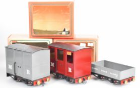 Three Mamod 0 gauge live steam passenger coach and goods wagons, all in original boxes.