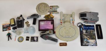 A collection of Star Trek related toys and memorabilia to include a framed Bajoran Communicator