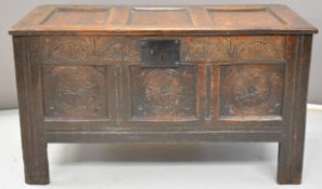 18thC carved oak panelled and jointed trunk raised on four square legs, W101 x D46 x H57cm