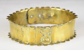 Victorian brass dog collar with toothed rims, applied '84' and engraved 'Dog, 1881' with heart