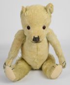 A vintage Teddy bear with golden mohair, disc joints and stitched features, circa 1930's/40's,
