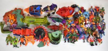 A collection of He-Man and the Masters of the Universe (MOTU) figures and vehicles by Mattel to
