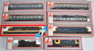 Eight Lima 00 gauge model railway locomotives and coaches, all in original boxes.