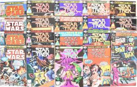 Twenty-one Star Trek and Star Wars comics by Marvel and Gold Key.