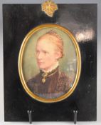 Victorian portrait miniature on card of a lady, monogrammed and dated 1887 to right hand edge,