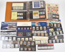 Small collection of presentation packs, loose and in a Royal Mail album