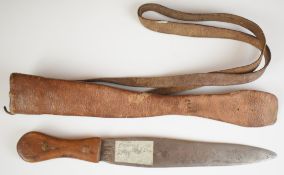 Hunting knife of crude construction, with 23cm double edged blade, wooden grip fixed with bronze