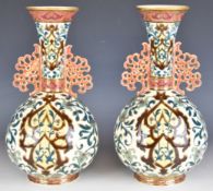 Zsolnay Pecs pair of pedestal vases with reticulated twin handles, height 32cm