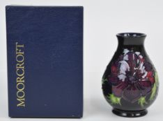 Moorcroft pedestal vase decorated in the Anemone pattern, in original box, height 13.5cm