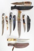 Six hunting daggers including a Chipaway example, five with sheaths, longest blade 23cm PLEASE
