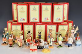 Twenty Royal Doulton Bunnykins figures including figures of the year, Punch, Judy, Doctor, Father,