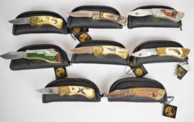 Eight Franklin Mint collector's knives including Colt, Smith & Wesson and Butch Cassidy, all in