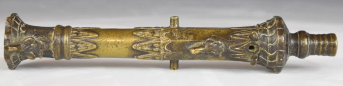 Brunei or similar eastern desk cannon with relief decoration and flared muzzle, 22cm long.