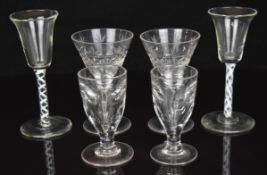 Six various drinking glasses comprising two with twist stems and four with cut decoration, largest