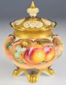 Royal Worcester covered and footed pot pourri decorated with painted fruit, indistinctly signed,