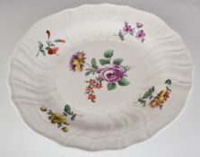 18th / 19thC Continental shallow dish with botanical decoration and beehive mark to base, possibly