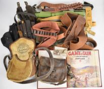 A collection of shooting and gun accessories including Brady and similar cartridge bags and belts,