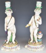 Pair of 19th / 20thC Volkstedt porcelain figural cherub candlesticks, height 32cm