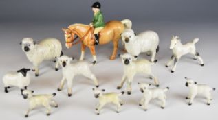 Beswick boy on a palomino pony and ten sheep, lamb and foal figures, tallest 14cm