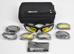 A pair of Daisy shooting glasses with four sets of interchangeable lenses, unused in original fitted