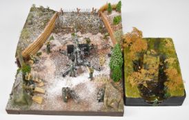 Military diorama featuring WW2 German 88mm anti-aircraft gun, together with a smaller scale