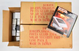 Twelve Daisy Porta Guard 270S solar charged infrared security alarms, all sealed in original boxes