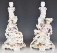 Pair of 19th / 20thC German porcelain figural candlesticks, height 39cm