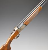 Lincoln 12 bore over and under shotgun with engraved locks, underside, top plate and thumb lever,