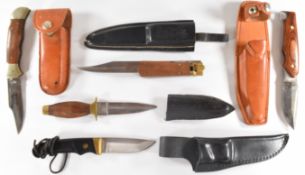 Five various hunting / folding knives including Buck USA, Jack Pyke and Shrae USA, all with sheaths,