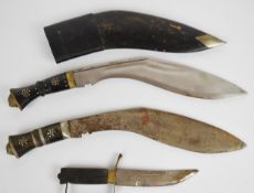 Two kukri knives, longest blade 30cm with one scabbard, together with a fighting knife  PLEASE