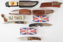 Four hunting knives, all with sheaths, together with three pocket / folding knives including an 'Old
