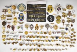 Approximately sixty military badges, buttons, rank insignia etc, including Royal Navy cap tallies,