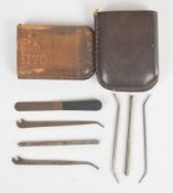 WW1 British small tools / instruments housed in a leather vesta sized holder, marked K Worth 1916