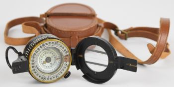 British WW2 compass marked T G Co Ltd No 29012 with broad arrow mark, dated 1944 Mk III with leather