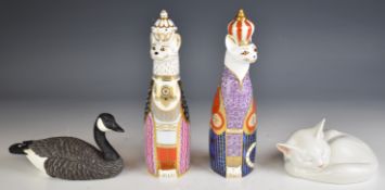 Pair of Royal Crown Derby 'Royal Cats' paperweights, Copenhagen cat and a wood carving of a Canada