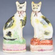 Opposing pair of 19thC Staffordshire spongeware cats, height 12.5cm
