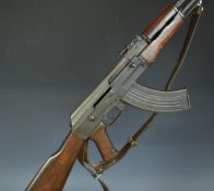Deactivated AK47 7.62x54mm assault carbine rifle with wooden pistol grip and stock, adjustable