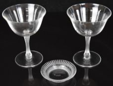 Three pieces of Lalique glass comprising a pair of champagne glasses with frosted stems (12.5cm