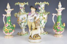 19thC pair of flower encrusted pedestal vases, pair of ewers with stoppers and a continental figure,