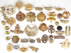Collection of military badges and buttons including Royal Naval Division, Drake, Hood, Nelson, Howe,