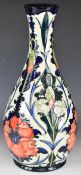 Moorcroft pedestal bulbous vase decorated in the Poppy pattern, signed and dated 96 to base,