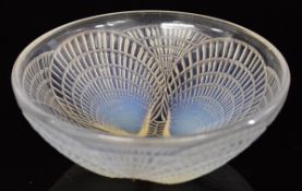 Lalique Coquilles opalescent glass bowl decorated with four shells and impressed 'R Lalique' to