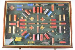 Shotgun cartridge display board of various named collector's cartridges including Eley, William