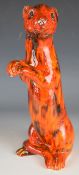 Anita Harris meerkat with dappled orange glaze, height 29cm