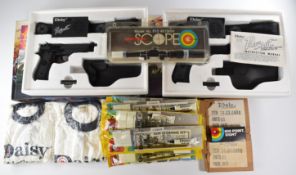 A collection of Daisy air guns and accessories comprising two Pursuit laser tag style pistol and