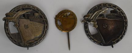 Two WW2 German Nazi Third Reich blockade runner's badges together with a stick pin example