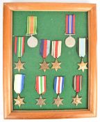 Mounted display of ten British WW2 medals including 1939/1945 Star, France & Germany Star, Burma
