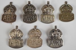 Six hallmarked silver WW2 ARP badges together with a Marples & Beasley marked example