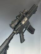 Colt M4 Carbine .22 semi-automatic assault style rifle with textured pistol grip, tactical stock,