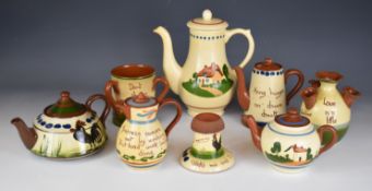 Collection of Devon motto ware including match striker, teapots, puzzle jug etc, tallest 25cm